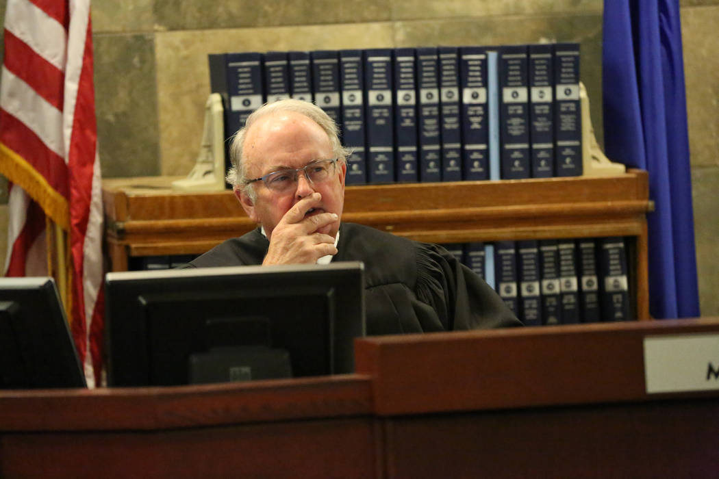 Judge Mark Denton listens to arguments from attorneys for the Siegel Group, the company that cl ...