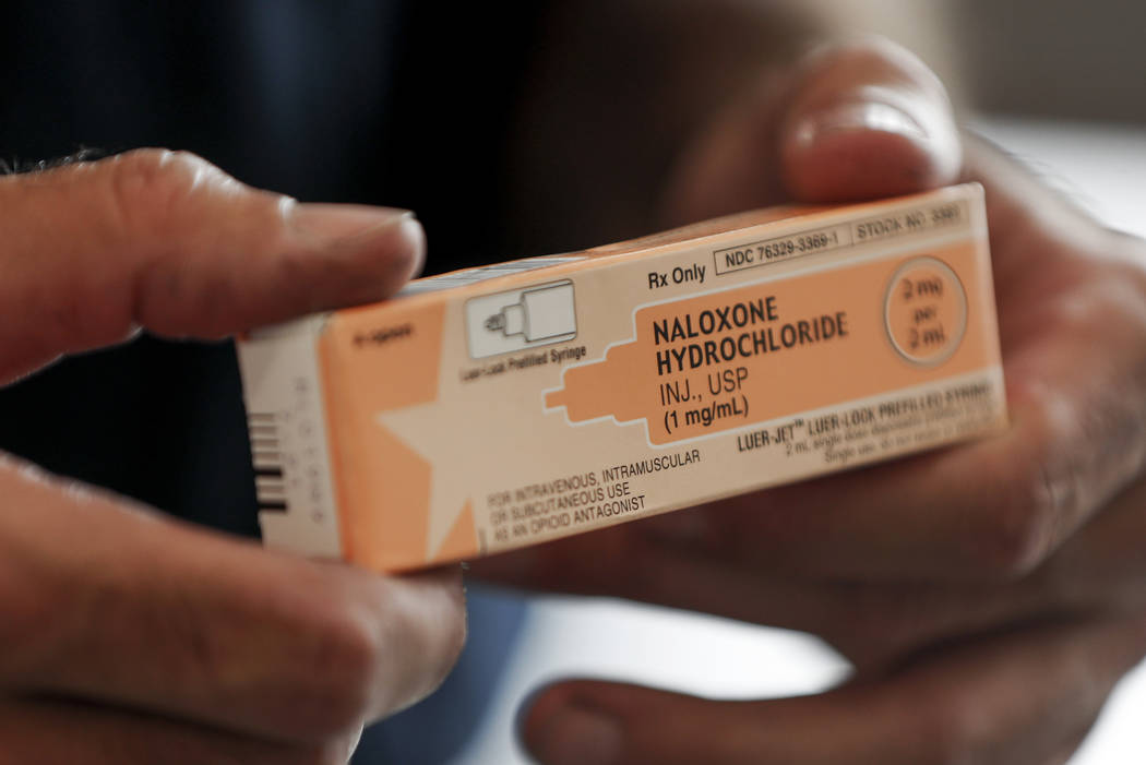 Akron fire medic Paul Drouhard shows a box containing Naloxone Hydrochloride, that is carried i ...