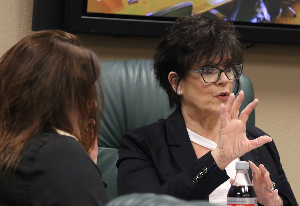 Nevada State Board of Dental Examiners Executive Director, Debra Shaffer-Kugel, right, speaks d ...