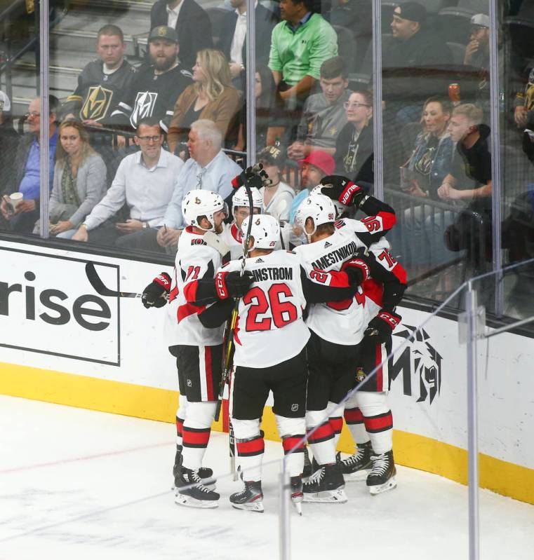 Ottawa Senators celebrate a goal against the Golden Knights during the first period of an NHL h ...