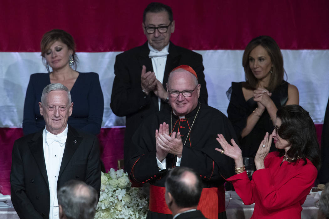 Cardinal Timothy Dolan, center, and 2019 Happy Warrior Award Recipient Mary Ann Tighe, right, a ...