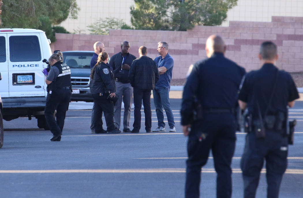 Police investigate a shooting involving a North Las Vegas police officer on the 4800 block of P ...