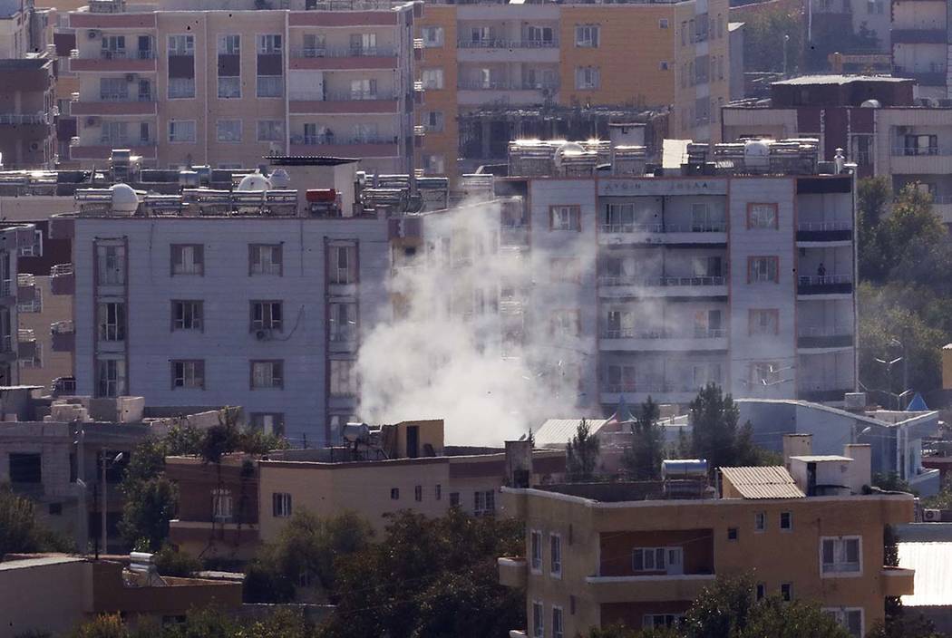 In this photo taken from the Turkish side of the border between Turkey and Syria, in Ceylanpina ...