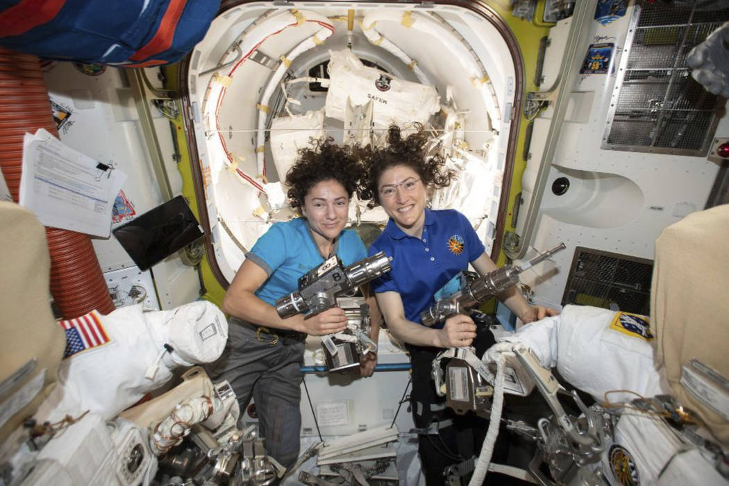 In this photo released by NASA on Thursday, Oct. 17, 2019, U.S. astronauts Jessica Meir, left, ...
