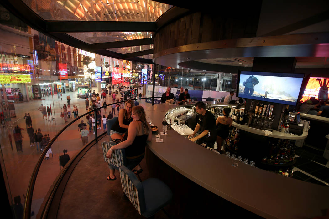 Trista Wells, left, and Sara Peterson, both of Kalispell Montana, at the rotating bar at Whiske ...