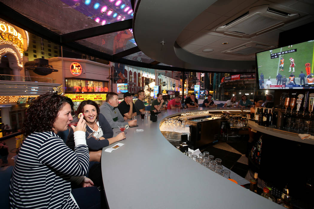 Kim Gullicks, left, and KerryAnn Thompson, both of Bismarck, N.D., at the rotating bar at Whisk ...