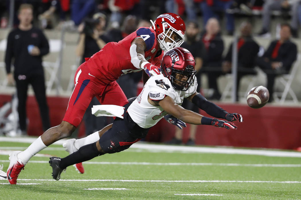 UNLV wide receiver Steve Jenkins tries to haul in a long pass as Fresno State defensive back Wy ...