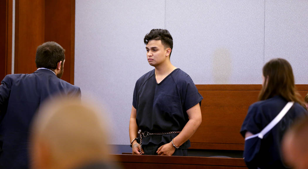 Henry Aparicio, 23, center, who is accused in a DUI crash that killed a man and a woman, makes ...