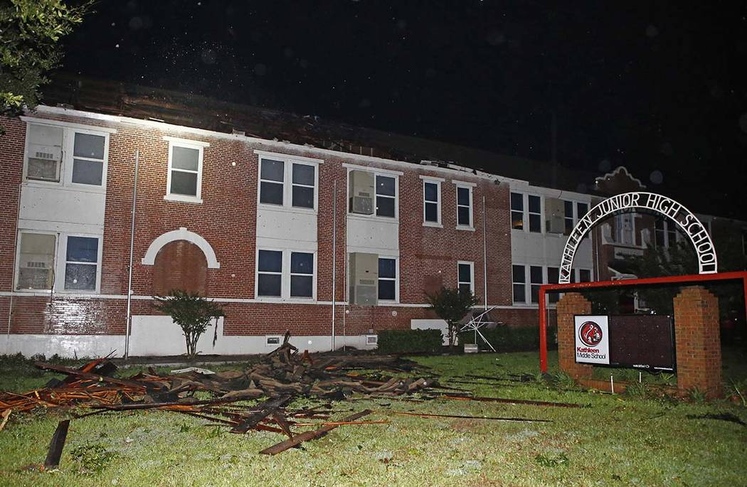 Major damage to the roof of Kathleen Middle School as a tornado ripped across Polk county due t ...