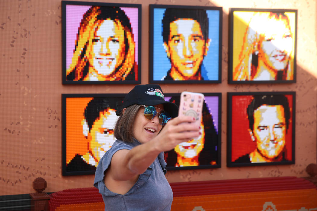 Lanae Brody, journalist for Hollywood Life, takes a photo inside the “Friends” Fan Experien ...
