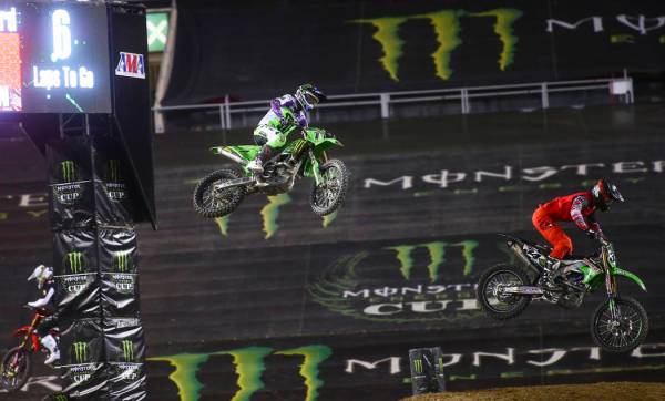 Eli Tomac (1) and Tyler Bowers (34) compete during the second round of the Monster Energy Cup S ...