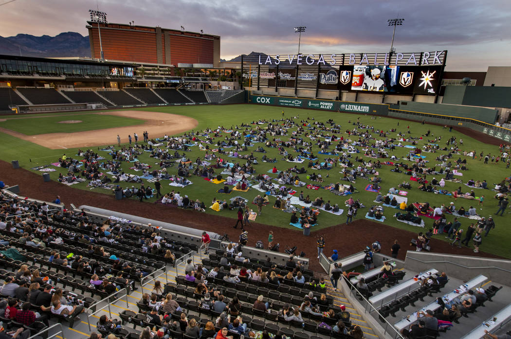 Fans relax on the field and in the stands during the first Vegas Golden Knights watch party as ...