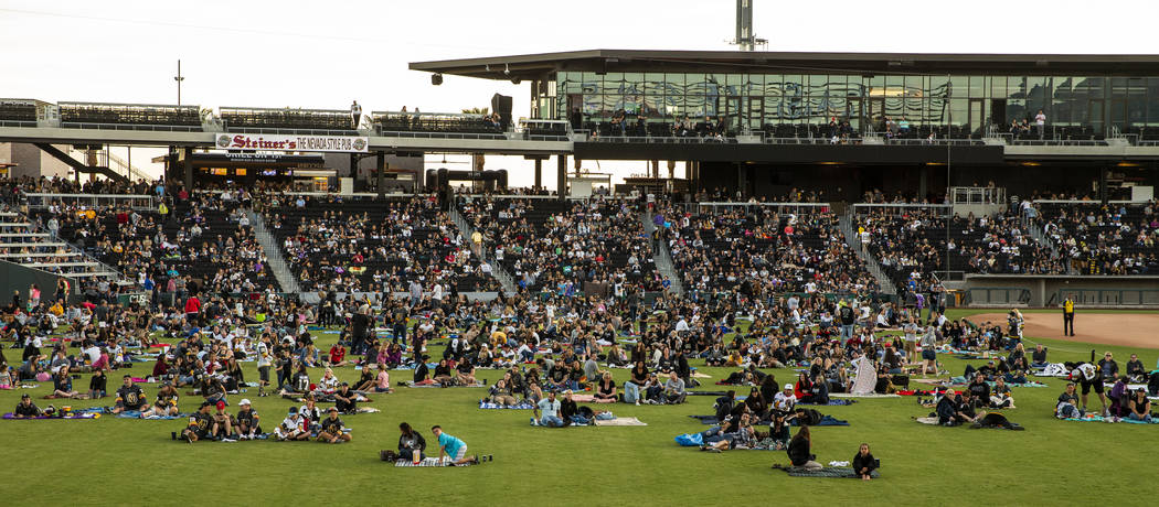 Fans relax on the field and in the stands during the first Vegas Golden Knights watch party as ...