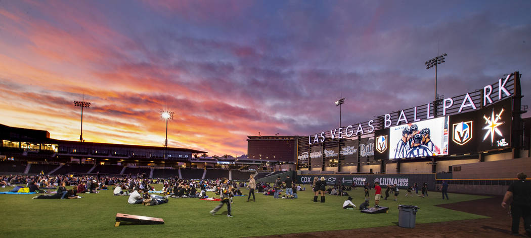 Fans relax on the field and in the stands during the first Vegas Golden Knights watch party as ...