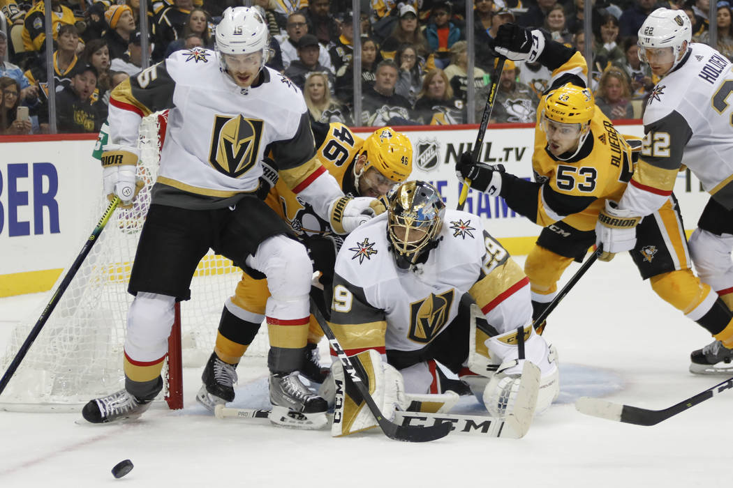 Vegas Golden Knights goaltender Marc-Andre Fleury (29), Jon Merrill (15) and Nick Holden (22) s ...