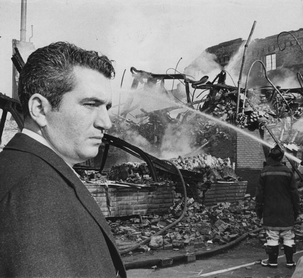 In this 1968 photo Baltimore Mayor Thomas D'Alesandro looks at the ruins of a Baltimore buildin ...