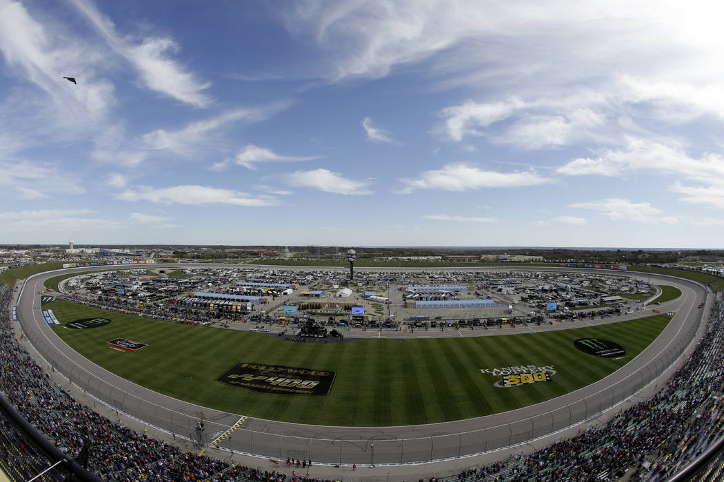 A B-2 Stealth bomber flies by before a NASCAR Cup Series auto race at Kansas Speedway in Kansas ...