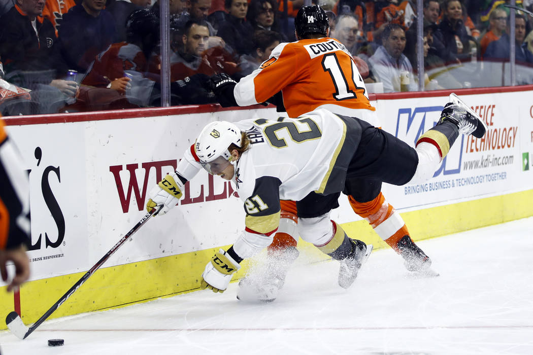 Philadelphia Flyers' Michael Raffl (12) scores against Vegas Golden Knights' Oscar Dansk, left, ...