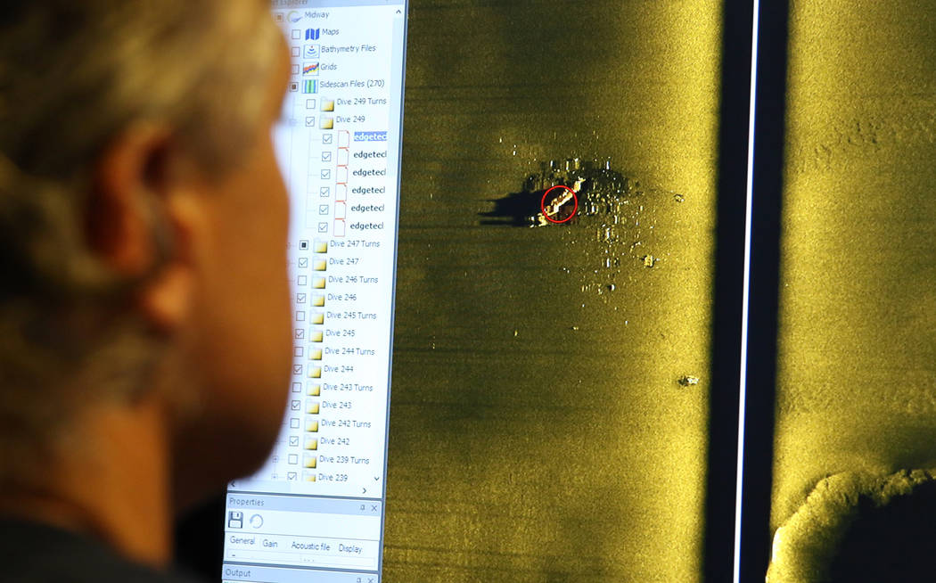 Rob Kraft, director of undersea operations at Vulcan Inc., reviews sonar scans of a warship fro ...