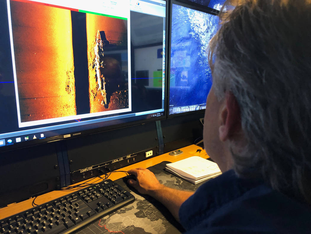 Rob Kraft, director of undersea operations at Vulcan Inc., reviews sonar scans of a warship fro ...