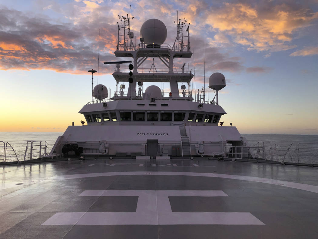 The sun rises over Vulcan Inc.'s research vessel Petrel nearly 200 miles off Midway Atoll in th ...