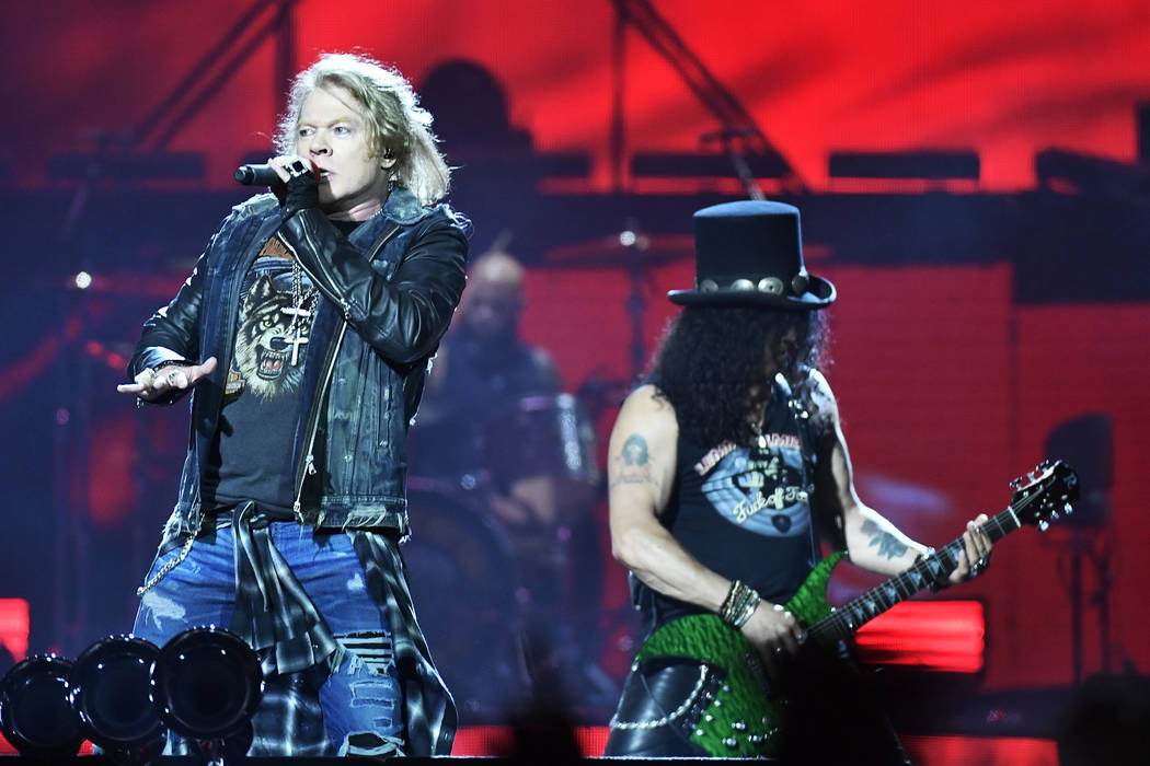 Axl Rose, lead singer, and Slash, guitarist of U.S. rock band Guns N' Roses, performs during a ...