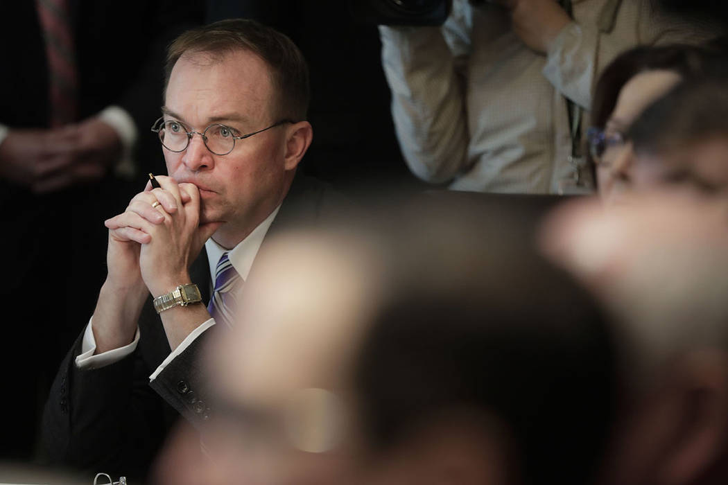 White House Chief of Staff Mick Mulvaney listens as President Donald Trump speaks during a Cabi ...