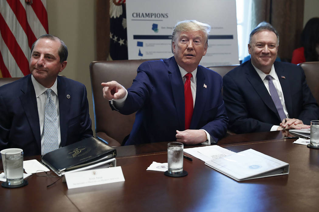 President Donald Trump, center, gestures during a Cabinet meeting in the Cabinet Room of the Wh ...
