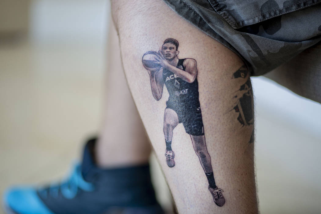 Local sports fan Trevor La Porte shows his recent tattoo of Las Vegas Aces player Dearica Hamby ...