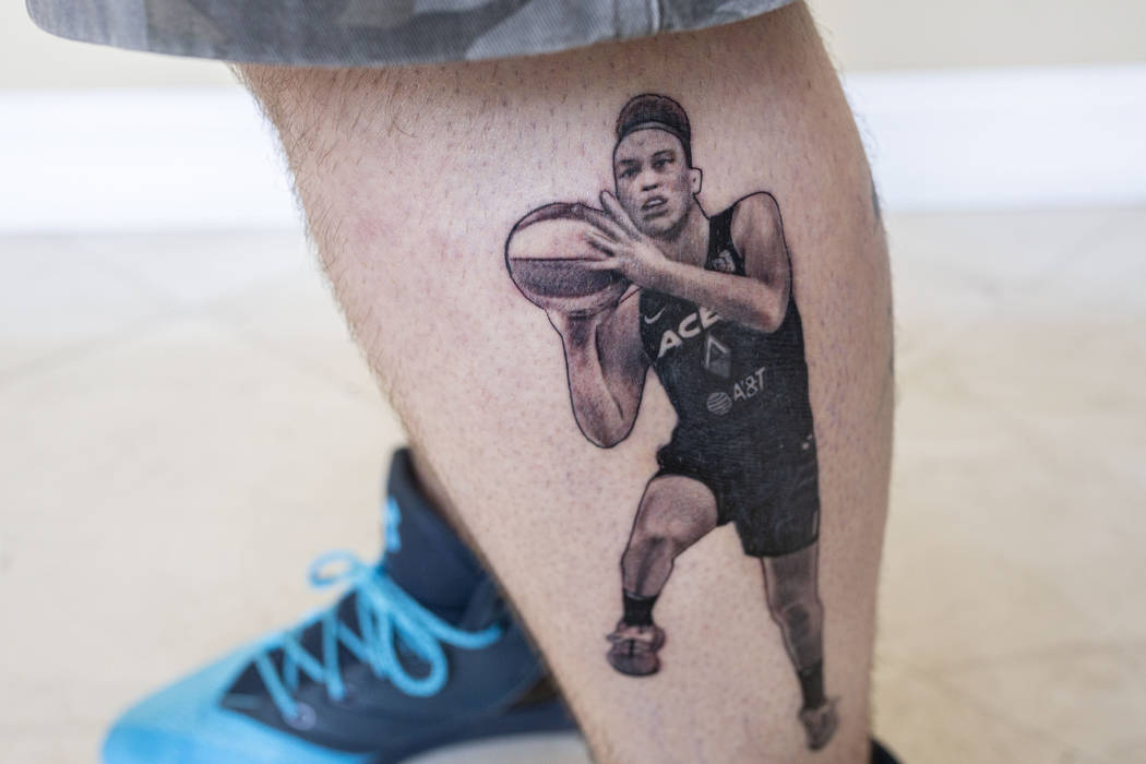 Local sports fan Trevor La Porte shows his recent tattoo of Las Vegas Aces player Dearica Hamby ...