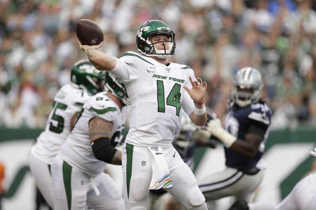 New York Jets quarterback Sam Darnold throws during the first half of an NFL football game agai ...
