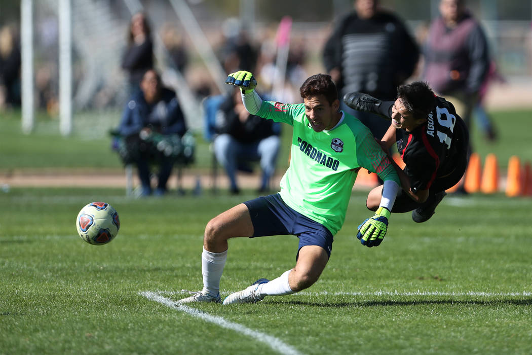 Las Vegas' Sergio Aguayo (18) takes a fall during the second half against Coronado in the 4A bo ...