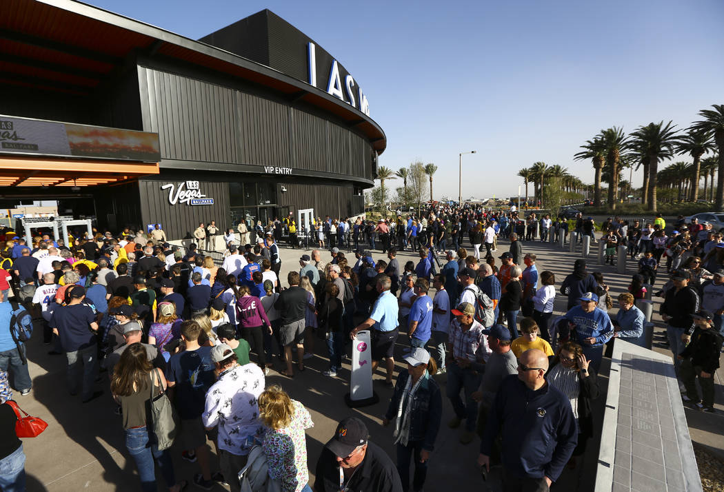 Fans line up to enter the Las Vegas Ballpark for the Las Vegas Aviators' home opener in Downtow ...