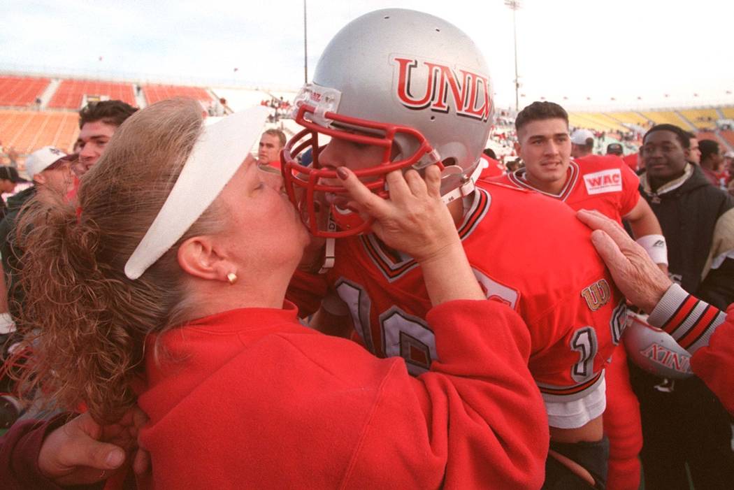 News UNLV freshman quarterback Jon Denton is kissed by his mother Karen Denton after the Rebels ...