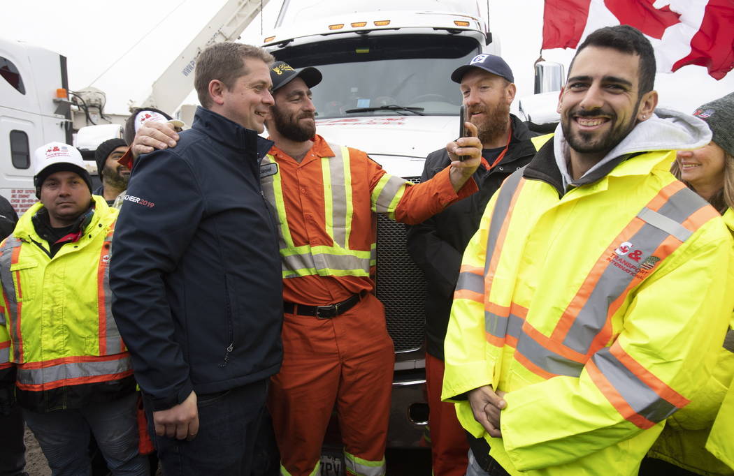 FILE - In this Oct. 17, 2019, file photo, Conservative leader Andrew Scheer poses for a photo w ...