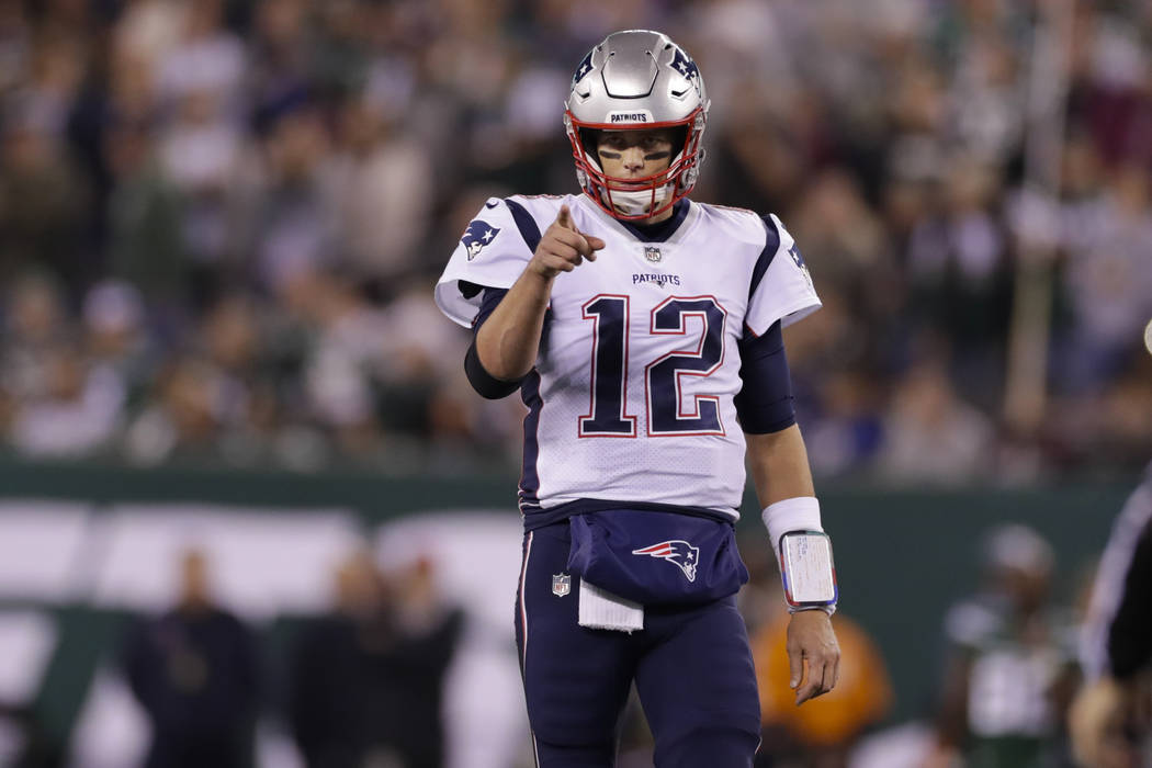 New England Patriots quarterback Tom Brady (12) points to Benjamin Watson (84) after a play dur ...