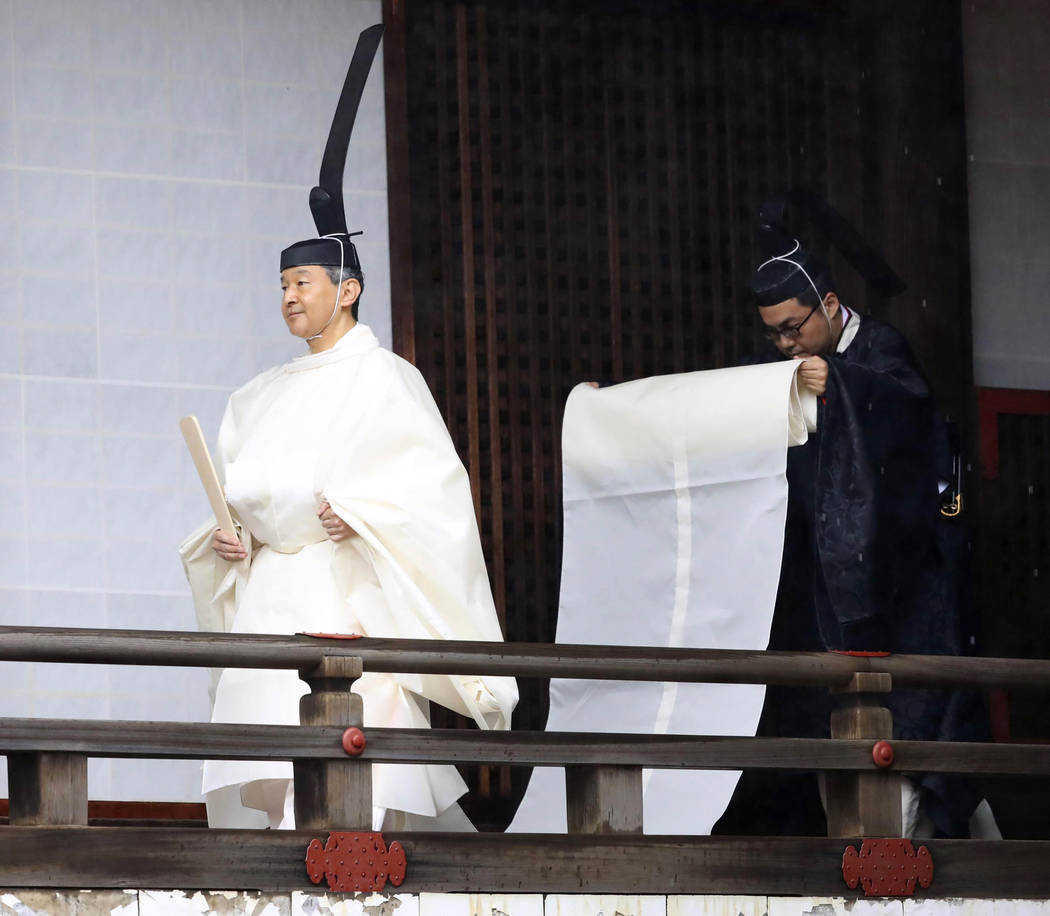 Japan's Emperor Naruhito, in a white robe, visits “Kashikodokoro”, a shrine at t ...