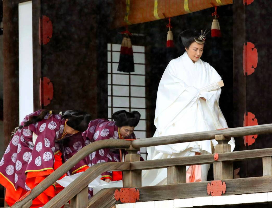 Japan's Empress Masako leaves after praying at “Kashikodokoro”, one of three shri ...