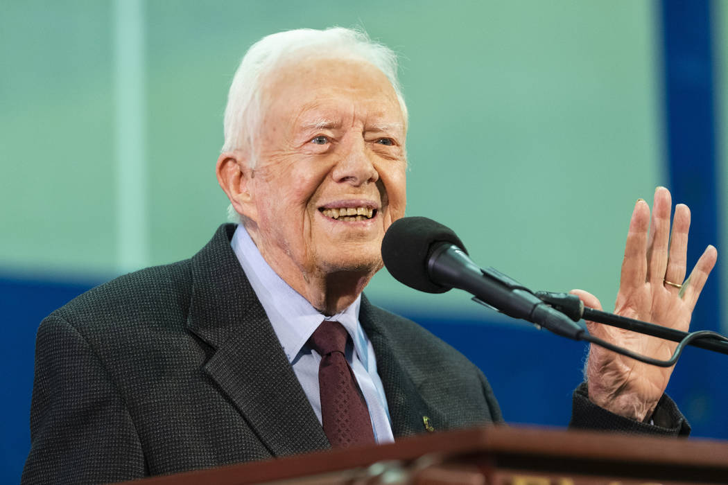 In a Sept. 18, 2019, file photo, former President Jimmy Carter acknowledges a student who's que ...