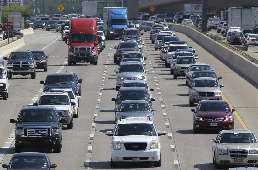 A July 1, 2016, file photo, shows drivers work their way out of Dallas during rush hour. The U. ...