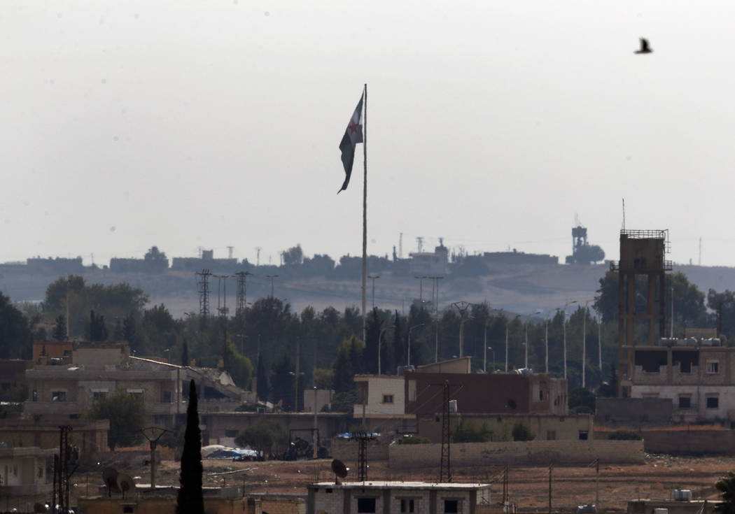 In this photo taken from the Turkish side of the border between Turkey and Syria, in Akcakale, ...