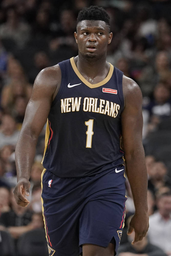 New Orleans Pelicans' Zion Williamson walks upcourt during the second half of an NBA preseason ...