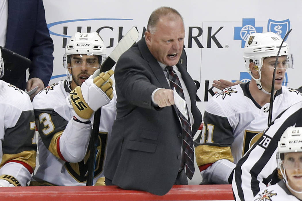 Vegas Golden Knights' Gerard Gallant, center, yells towards an official during the third period ...