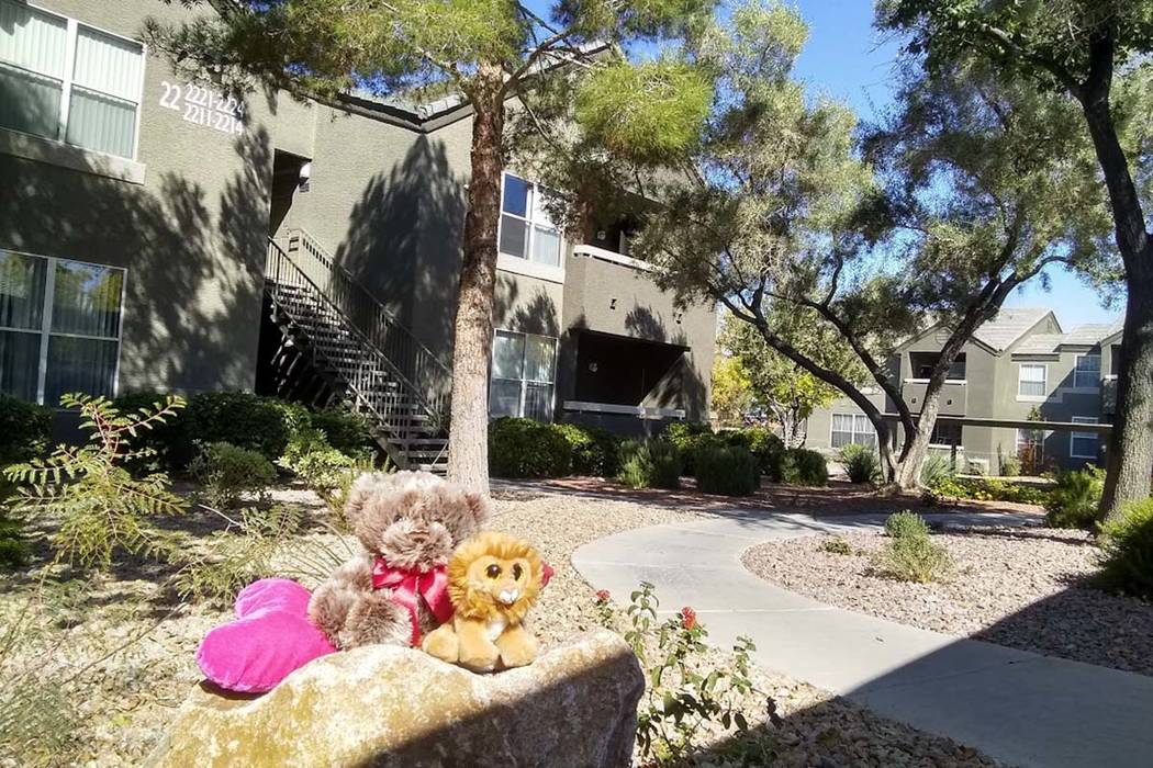 A makeshift memorial is set up outside of a building at the Equestrian on Eastern Apartments, T ...