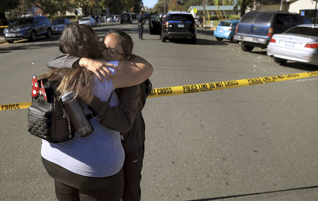 Xiomara Martinez, left, embraces her sister Alondra Moya after Moya and other students were rel ...