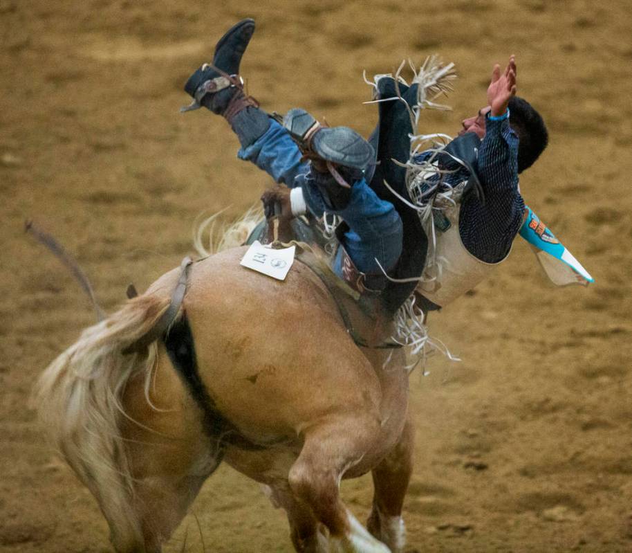 Bareback rider Delvecchio Kay ends up sideways on his horse during the first round of the India ...