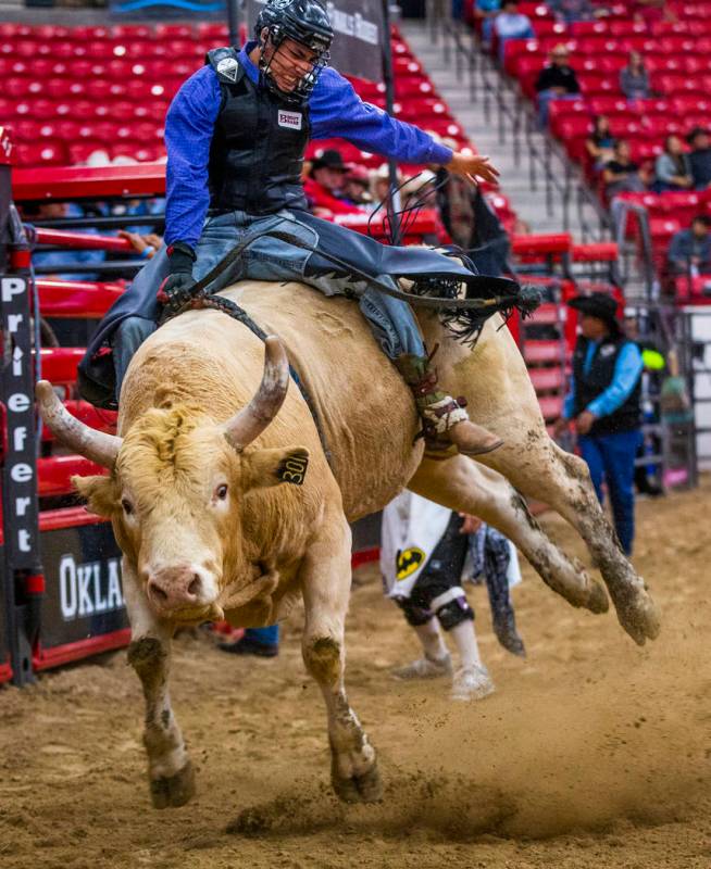 Bull rider Riel Bruised Head holds tight onto his bull during the first round of the Indian Nat ...