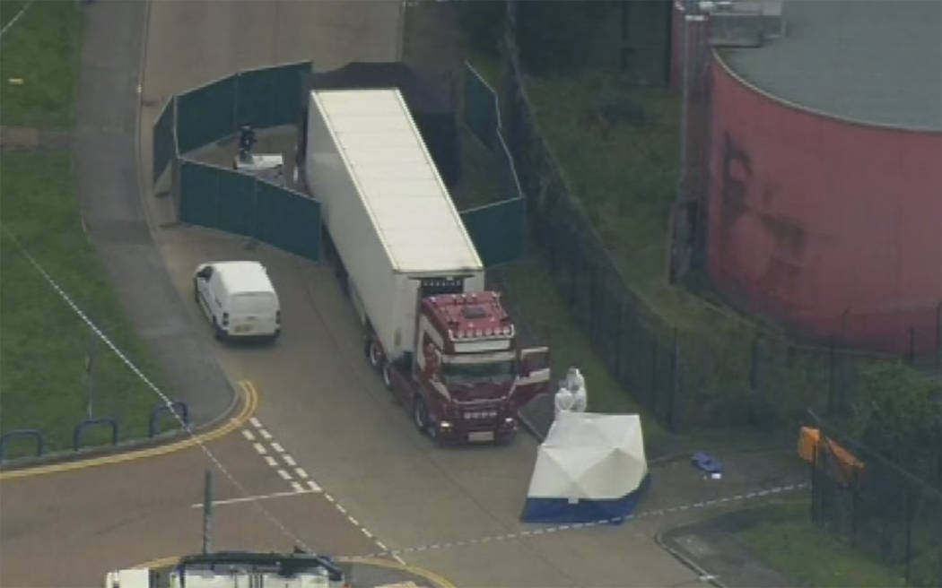 An aerial view as police forensic officers attend the scene after a truck was found to contain ...