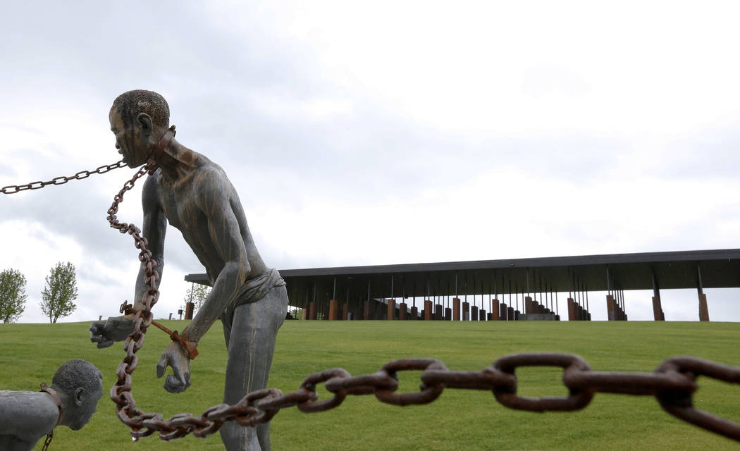 FILE - In this Sunday, April 22, 2018, file photo, a statue of a chained man is on display at t ...