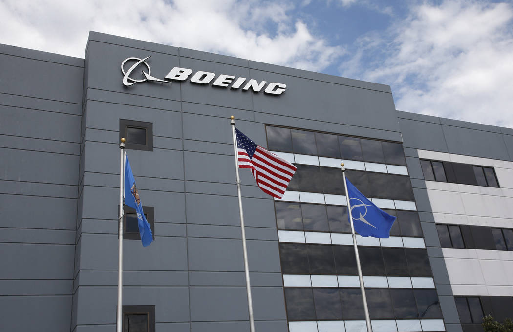 FILE - In this May 14, 2019, file photo flags fly outside the main building of The Boeing Compa ...